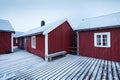 Traditional red wooden houses on the shore of Reine fjord. Beautiful winter scene of Vestvagoy island. Picturesque morning view Royalty Free Stock Photo