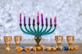 Traditional religion symbol of Jewish holiday Hanukkah with Hanukkiah menorah burning