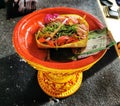 Traditional religious daily offering at balinese hindu temple on Bali island in Indonesia Royalty Free Stock Photo