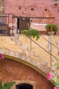 Part of the traditional greek building colors with terrace, doors, flowers and restaurant table in Chania, Crete