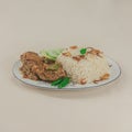 A traditional rice dish Pilaf or pilau is homemade and decorated with chicken roast
