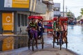 Traditional rickshaw bicycle with Malagasy people on the street of Toliara, one of the ways to earn money. Everyday life on the