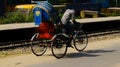 Traditional rickshaw pullers around a city streets in India