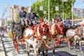 Traditional riding horse carriages celebrating Seville`s April Fair.