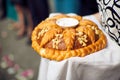 A traditional ritual of offering bread and salt to a welcome guest.