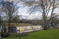 Traditional river boat moored next to the river bank Royalty Free Stock Photo