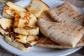 Traditional roasted or grilled halloumi cheese from Cyprus served hot with flat bread