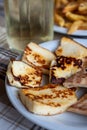 Traditional roasted or grilled halloumi cheese from Cyprus served hot with flat bread