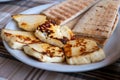 Traditional roasted or grilled halloumi cheese from Cyprus served hot with flat bread