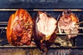 Traditional roasted shank cooking on charcoal spit roaster