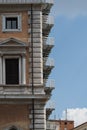 Corner of an apartment block with windows and balconies in Rome, Italy Royalty Free Stock Photo