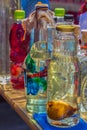 Traditional Romanian drink in bottles decorated with paintings. Sapanta, Maramures, Romania