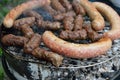 Traditional Romanian food, barbecue with grilled meat rolls, mititei or mici (beef, pork and lamb meat) and sausages