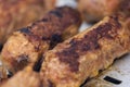 Traditional Romanian food called "mici" which consist of pork meat rolls Royalty Free Stock Photo