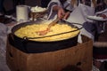 Hominy prepared in a caldron on fire