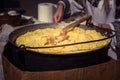 Hominy prepared in a caldron on fire