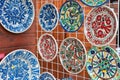 Traditional romanian handmade ceramic pottery plates with rustic authentic decoration paintings on display Royalty Free Stock Photo