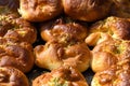 Traditional Romanian sweets knows as poale in brau, freshly homemade cheese and dill buns on display for sale at a street food