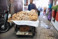 Traditional round bread arrive to be sold at a local market near Marekesh, Morocco.