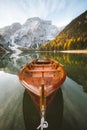 Traditional rowing boat at Lago di Braies at sunrise in fall, South Tyrol, Italy Royalty Free Stock Photo