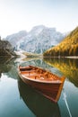 Traditional rowing boat on a lake in the Alps in fall Royalty Free Stock Photo