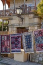 Traditional Rugs Hanging Outside Rustic Building Royalty Free Stock Photo