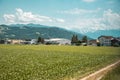 Traditional rural landscape with small houses and green fields in Switzerland Royalty Free Stock Photo