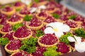 Traditional russian beet salad in waffle baskets for new year