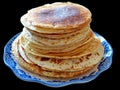 Traditional russian blini isolated on a black background. Pancakes. Pancake week. Maslenitsa Royalty Free Stock Photo