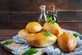 Traditional Russian cabbage pies on wooden background. Baked homemade pirozhki with cabbage