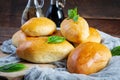 Traditional Russian cabbage pies on wooden background. Baked homemade pirozhki with cabbage