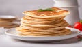 Traditional Russian Crepes Blini stacked in a white plate on light background. Maslenitsa traditional