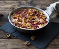 Traditional Russian dessert Guriev Porridge, Semolina porridge with dried fruits and walnuts, honey, cinnamon, cream, raspberry Royalty Free Stock Photo