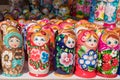 Traditional Russian folk crafts. Multicolored wooden nesting dolls stand on a street counter