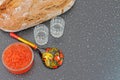 Traditional russian food. Red caviar in a glass bowl and fresh baked bread. Royalty Free Stock Photo