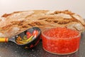 Traditional russian food - red caviar. Wooden spoon painted in traditional style Khokhloma. Royalty Free Stock Photo