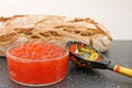 Traditional russian food - red caviar. Wooden spoon painted in traditional style Khokhloma. Royalty Free Stock Photo