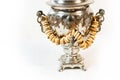 Traditional Russian old samovar for tea drinking with tasty bagels Royalty Free Stock Photo