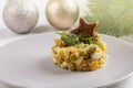Traditional Russian Olivier salad decorated with toast star in Christmas decoration Royalty Free Stock Photo