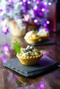 Traditional Russian Olivier salad is served in tartlets. Royalty Free Stock Photo