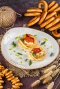 Traditional russian pelmeni or meat dumplings with Ravioli with pepper on white background