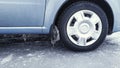 Icicles on the wheel arch close-up. Car on ice.