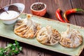 Traditional russian pelmeni, ravioli, dumplings with meat in plaTraditional russian pelmeni, ravioli, dumplings with meat in plate Royalty Free Stock Photo
