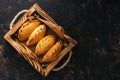 Traditional Russian pies in a wooden tray on a dark rustic background. Russian pirozhki ,baked patties. Top view, copy space, flat