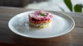 Traditional Russian salad with beetroot and herring vegetables, lying on a wooden table in a white plate Royalty Free Stock Photo