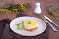 Traditional Russian salad Mimosa with boiled pink salmon, carrots, onions and eggs Royalty Free Stock Photo