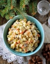 Traditional Russian salad Olivier on an old wooden background. Russian kitchen. Royalty Free Stock Photo