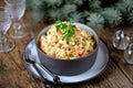 Traditional Russian salad Olivier on an old wooden background. Russian kitchen. Royalty Free Stock Photo