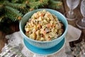 Traditional Russian salad Olivier on an old wooden background. Russian kitchen. Royalty Free Stock Photo