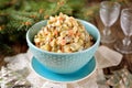 Traditional Russian salad Olivier on an old wooden background. Russian kitchen. Royalty Free Stock Photo